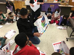 students looking at maps of the most common natural disasters in the US